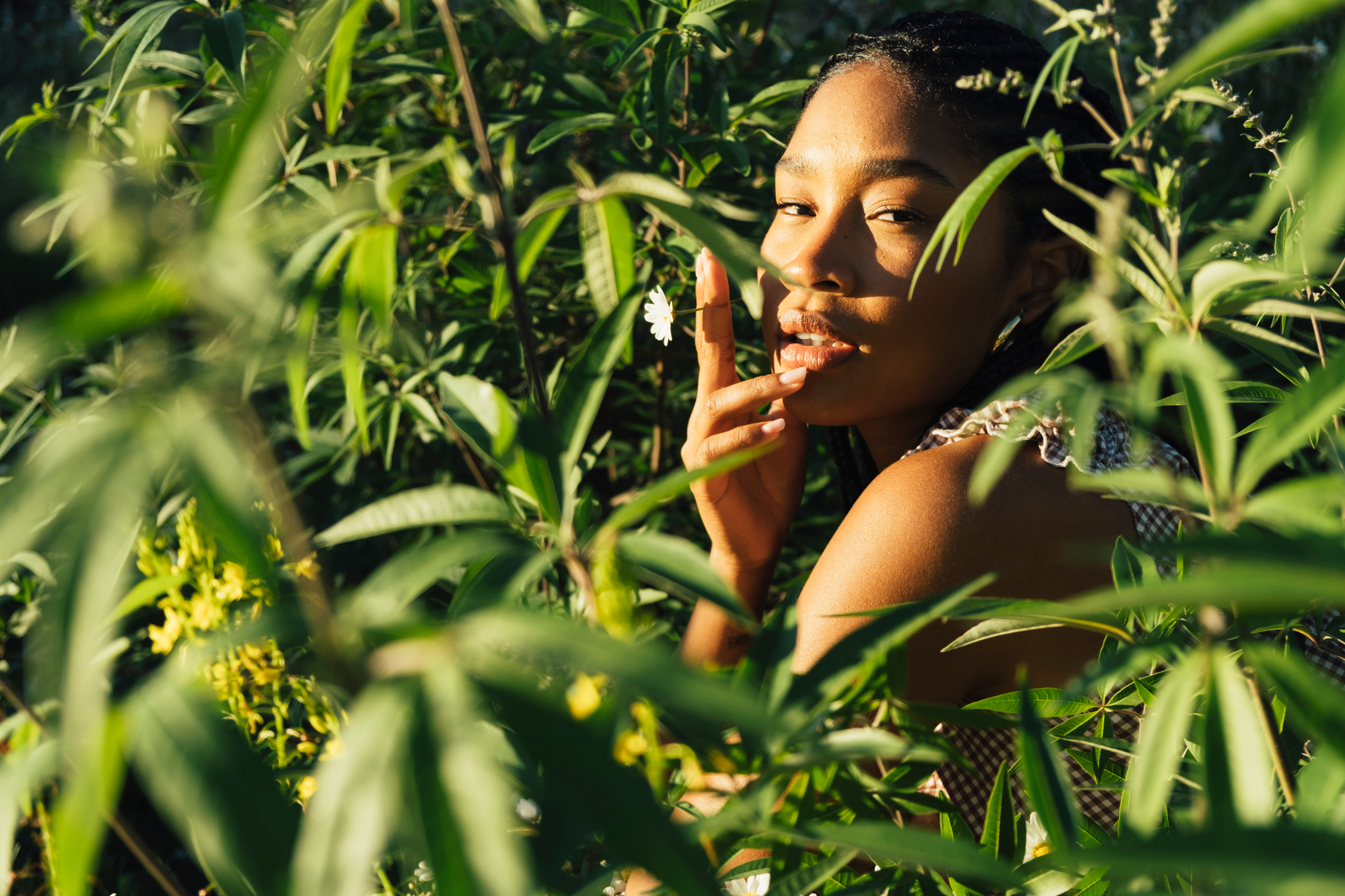 Daisy community member laughing in a field